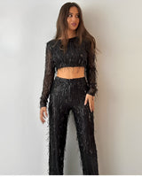 Elegante tweedelig set met top met lange mouwen en stijlvolle broek