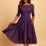 Flowy midi jurk met korte mouwen en hoge tailleband