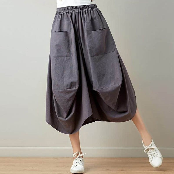 Relaxte gedrapeerde broek met praktische zakken en vloeiend silhouet